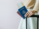 Traveler checking last-minute documents at the airport, realizing they are not eligible for vietnam visa free entry and need an urgent visa to enter Vietnam