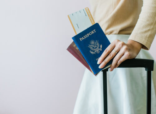 Traveler checking last-minute documents at the airport, realizing they are not eligible for vietnam visa free entry and need an urgent visa to enter Vietnam